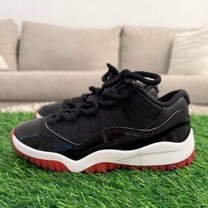 Jordan Kids Black and Red Low-Top Sneakers Retro 11c